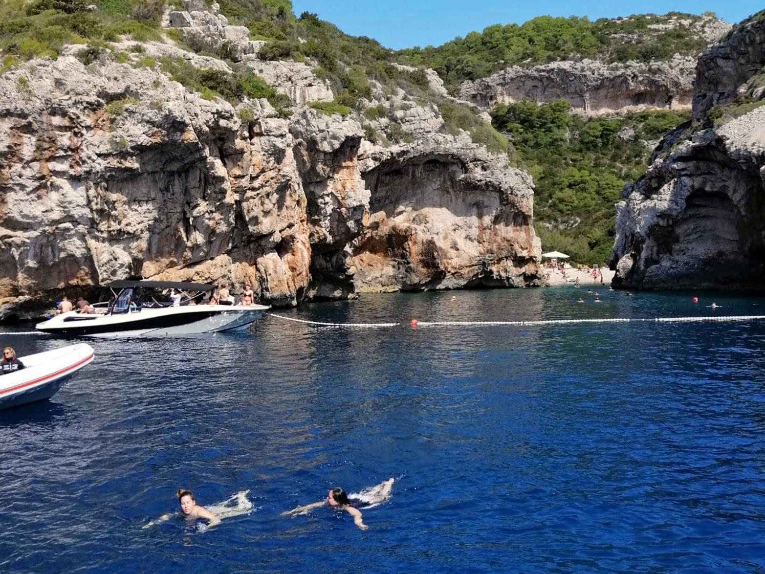 Crystal clear sea of the Stiniva Cove on islands VIs
